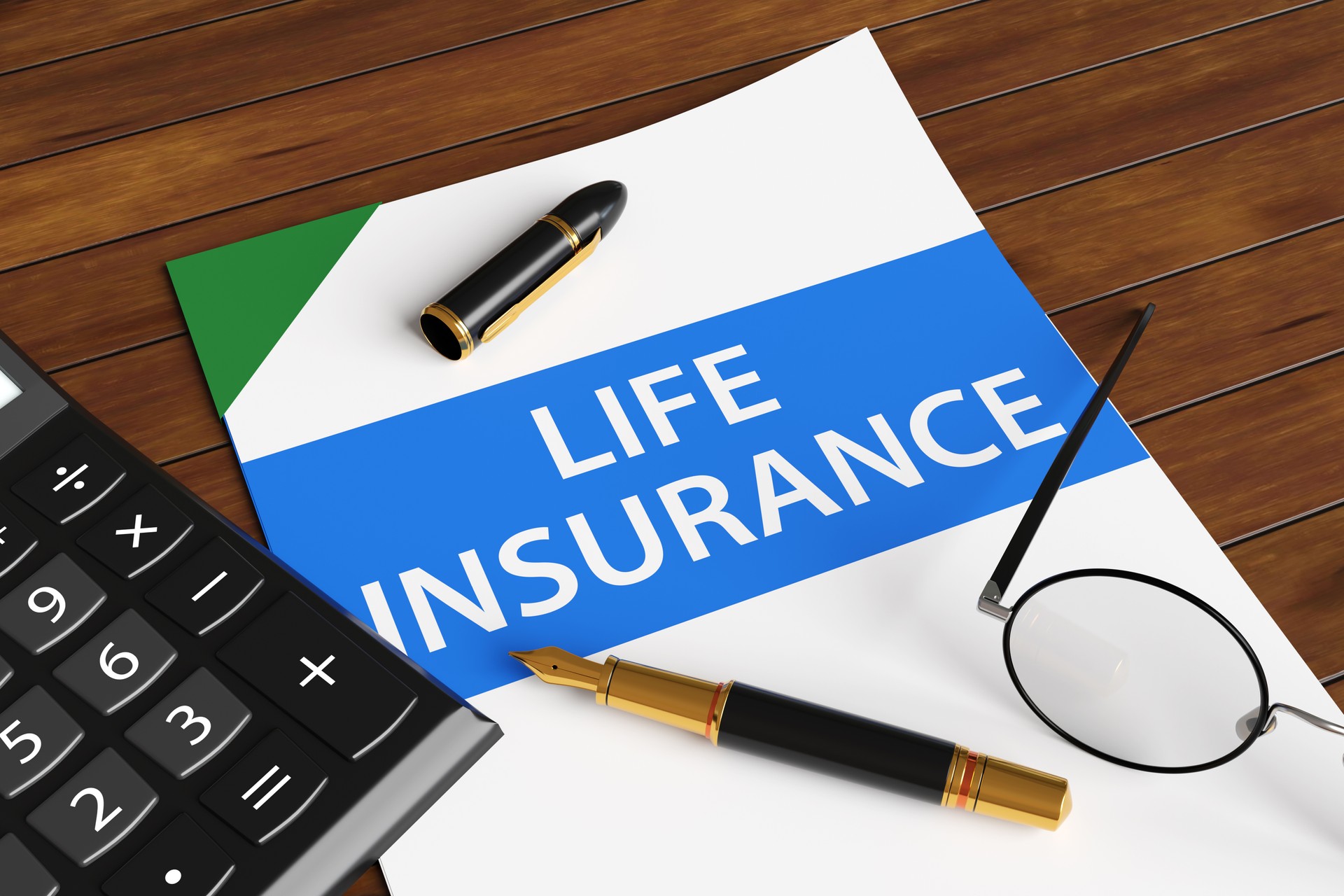 Bound life insurance service agreement, a golden fountain pen, a black calculator and spectacles on a wooden table. Illustration of the concept of financial security for family and insurance sector